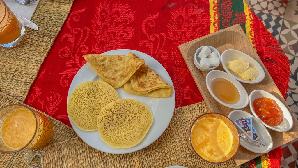 traditional moroccan breakfast of msemen and baghrir in hostel dar ben youssef