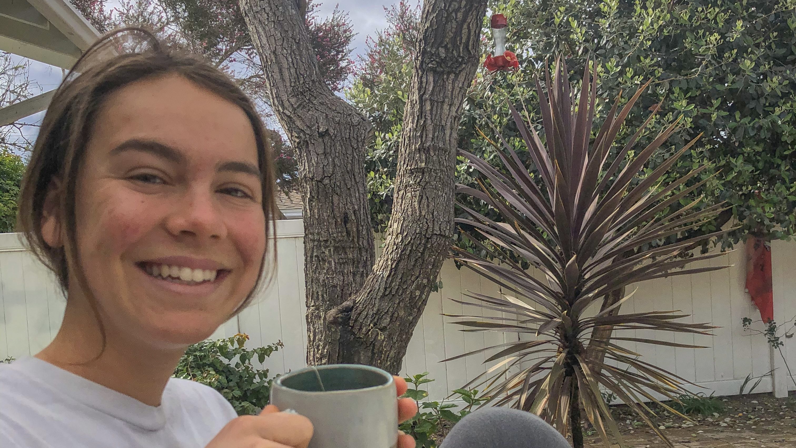 girl drinking tea outside