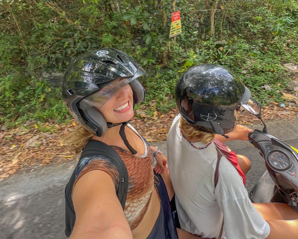 digital nomad travel insurance, two girls on motorbike in Bali