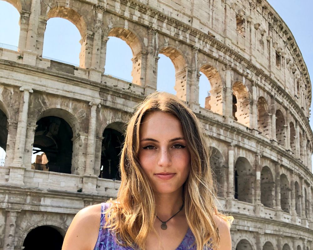 girl in front of colosseum